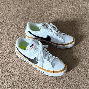Women’sNike Legacy Court White and Gold Sneakers with Black Swoosh